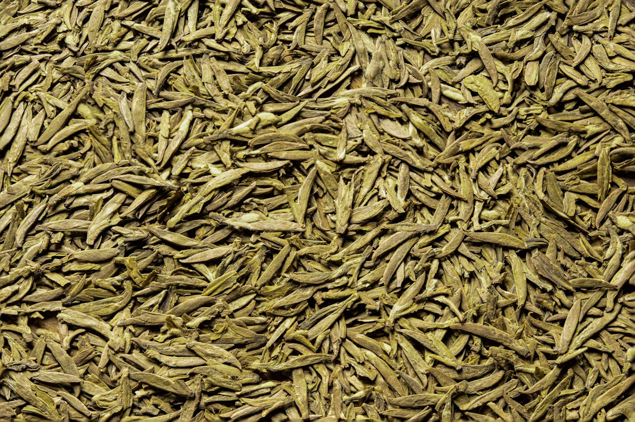 Detailed close-up of organic green tea leaves, capturing texture and color in Hangzhou.