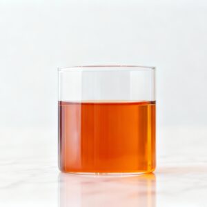 Amber-red liquor of Keemun black tea in a porcelain tasting cup
